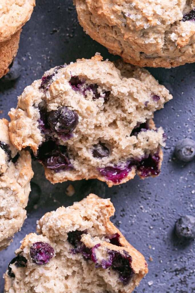 close up of a muffin cut in half to show the fluffy inside