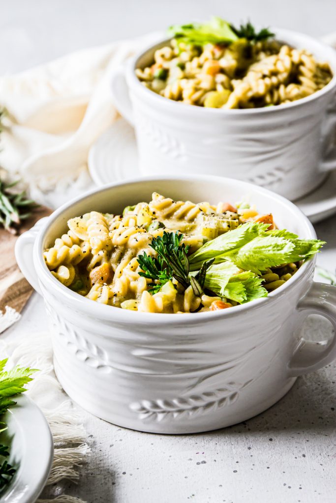 chicken noodle stew served in little pots garnished with parsley