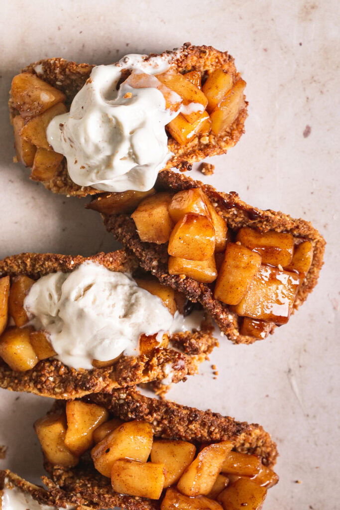 close up of apple pie tacos with partially melted ice cream