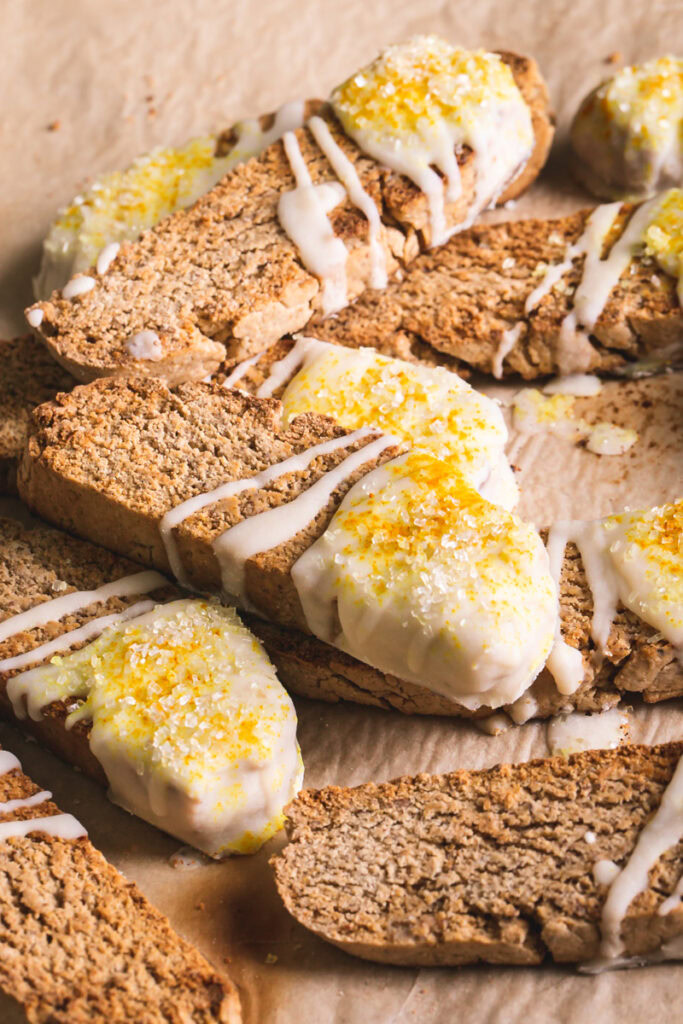 3/4 close up view of lemon vanilla biscotti stacked on top of one another