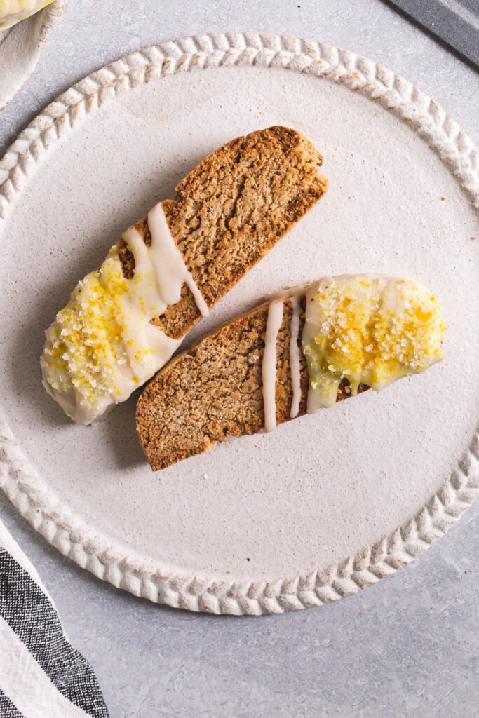 two lemon vanilla biscotti on a white plate