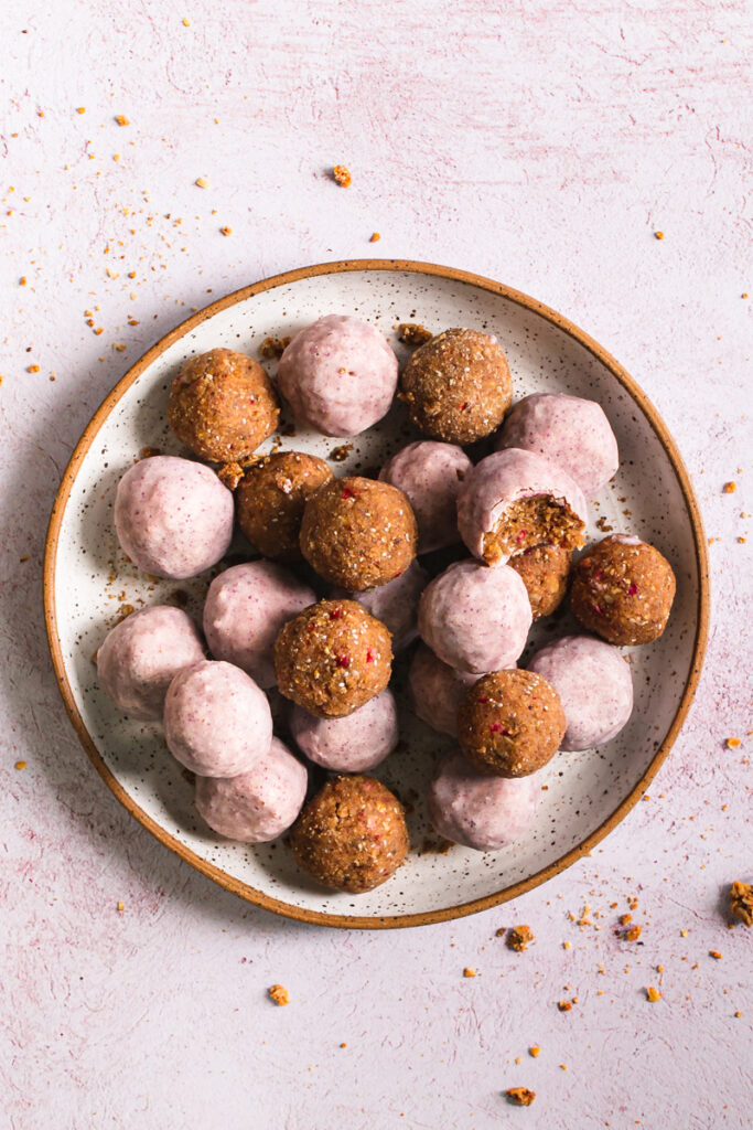 a plate full of strawberries and cream granola bites