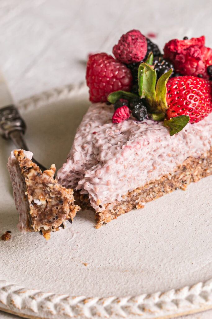 close up of breakfast chia yogurt granola tart with a piece on a fork