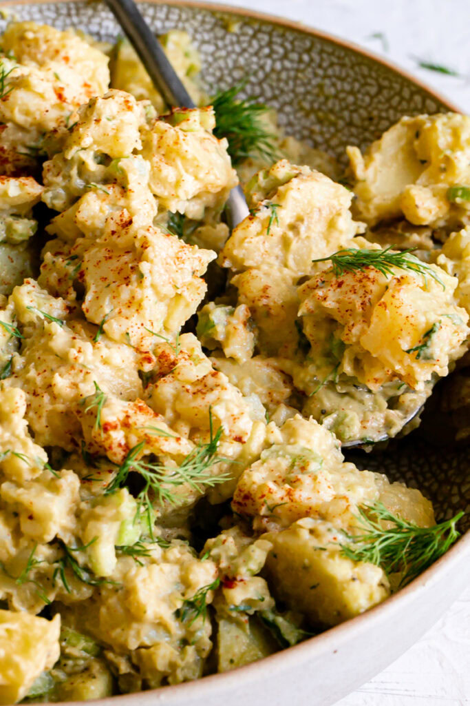 close up of a bowl of smoked paprika dill potato salad