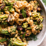 a close up overhead shot of a bowl of tahini harissa cauliflower