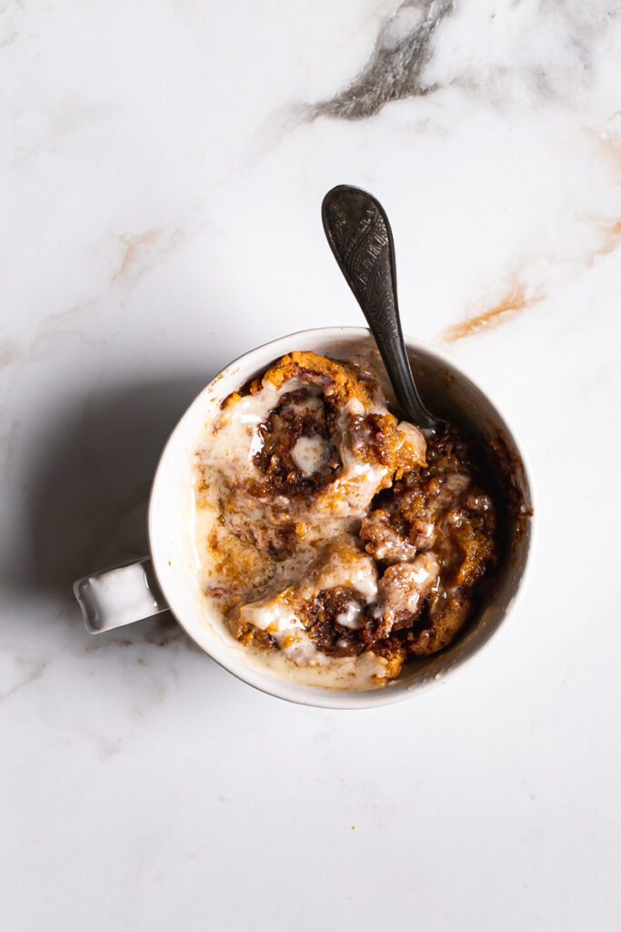 a single mug of pumpkin cinnamon roll mug cake