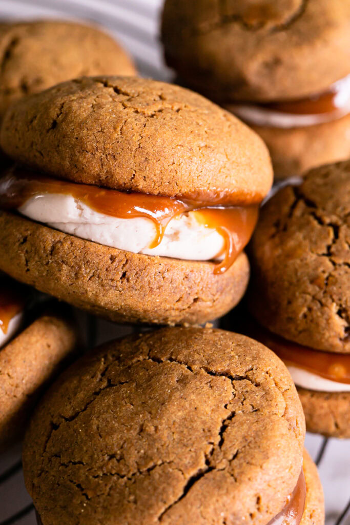a pile of pumpkin spice latte whoopie pies