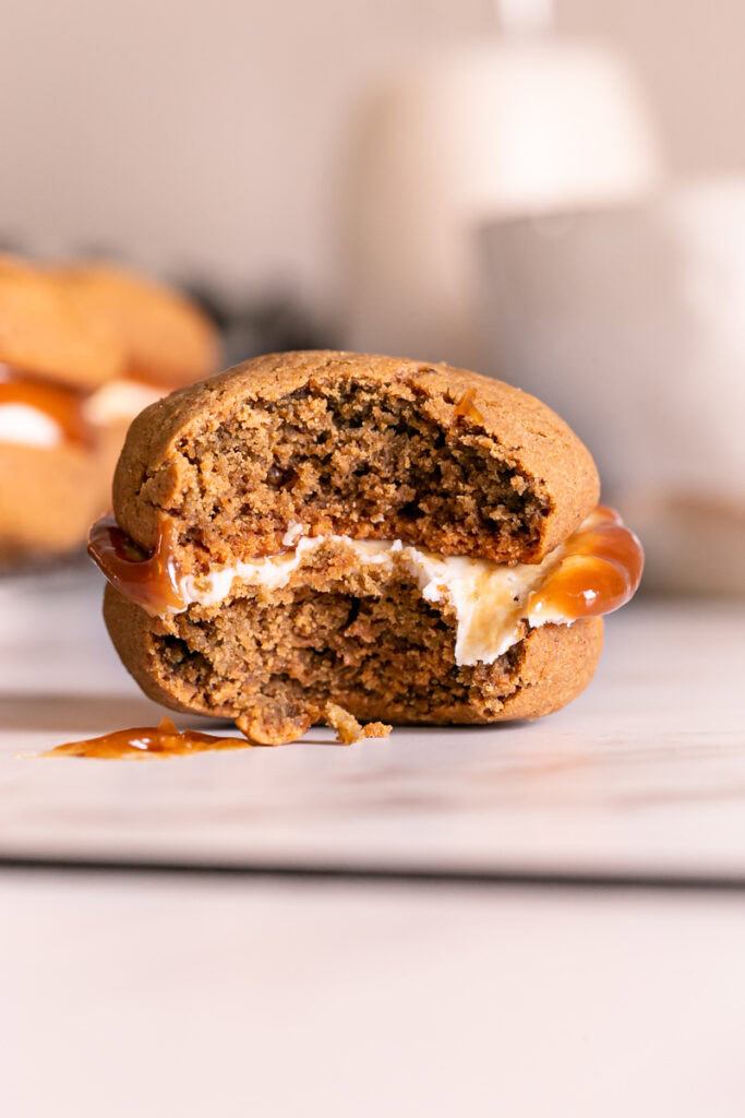 a single macaron with a bite taken out of it