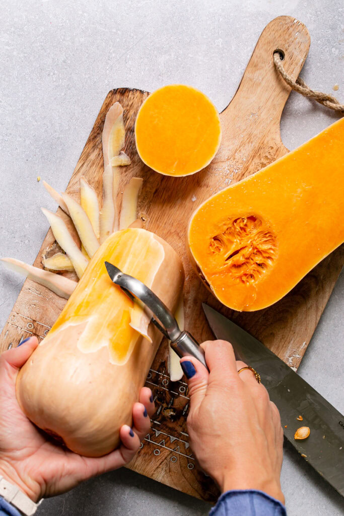 action shot of me peeling the butternut squash half