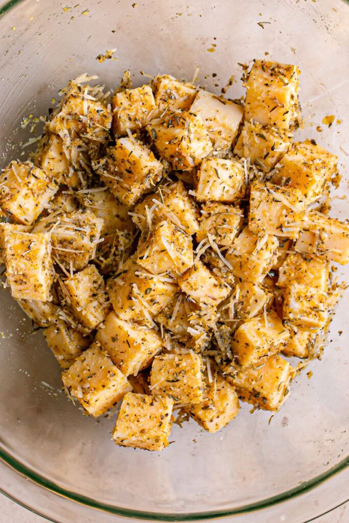 the seasonings mixed in with the polenta in a glass bowl before baking
