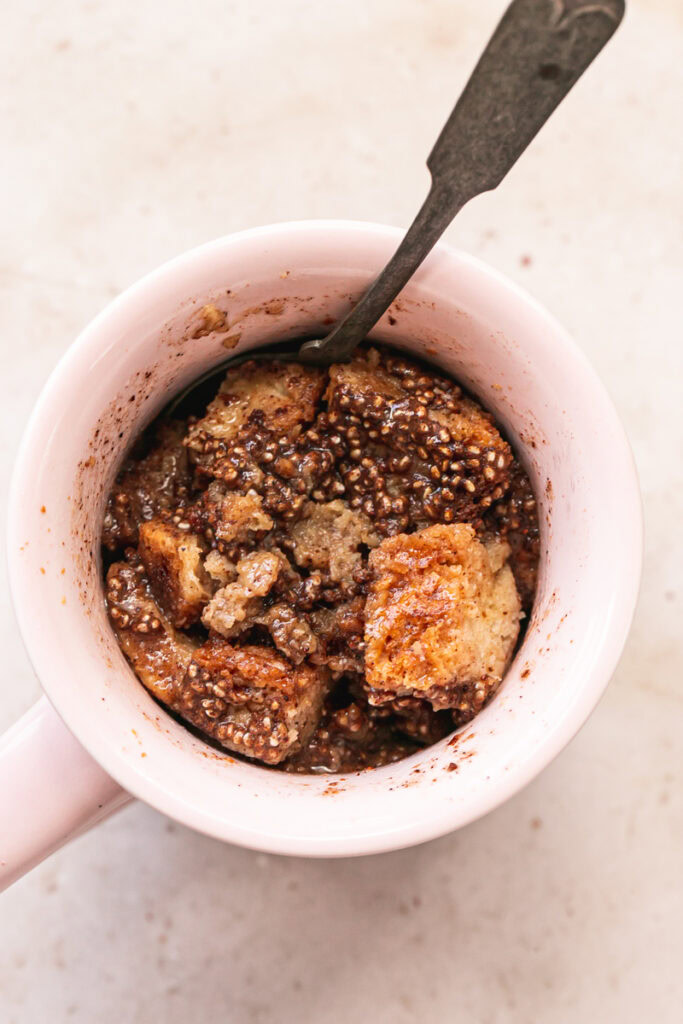 cooked French toast in a mug with a spoon in it