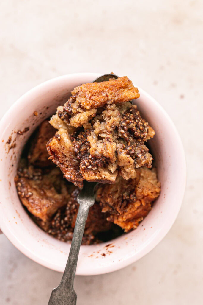 Vegan GLuten-Free French Toast in a Mug with some scooped on a spoon