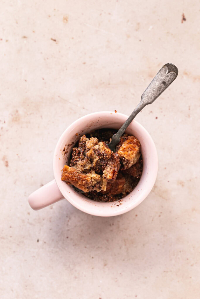 a mug of Vegan GLuten-Free French Toast with a spoon in it