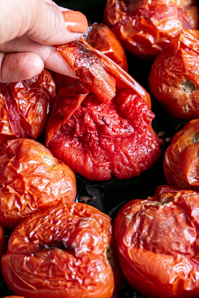 peeling the skin off of the tomato