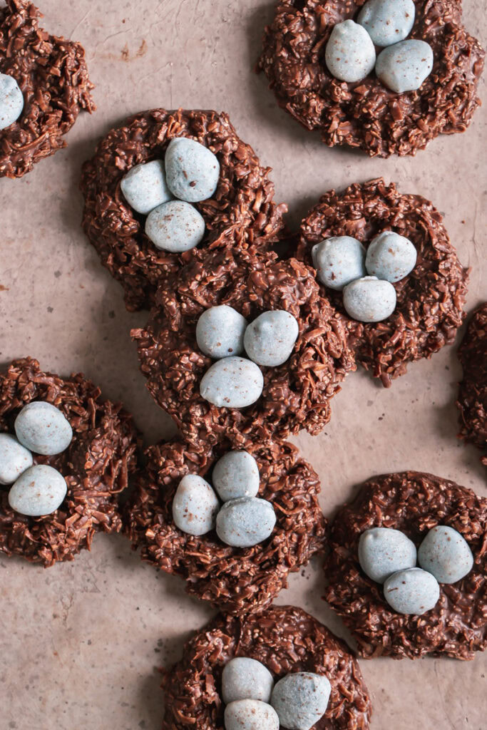 Toasted Coconut Chocolate Bird's Egg Nest Cookies filled with three robin's egg white chocolate covered almonds in each nest