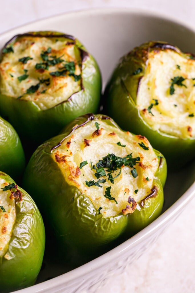 baked shepherds pie stuffed peppers garnished with parsley