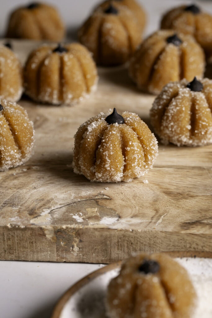 Sugared Almond Flour Pumpkin Cookie Dough on a wooden cutting board