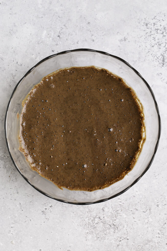 all of the chia pudding ingredients mixed together in a glass bowl.
