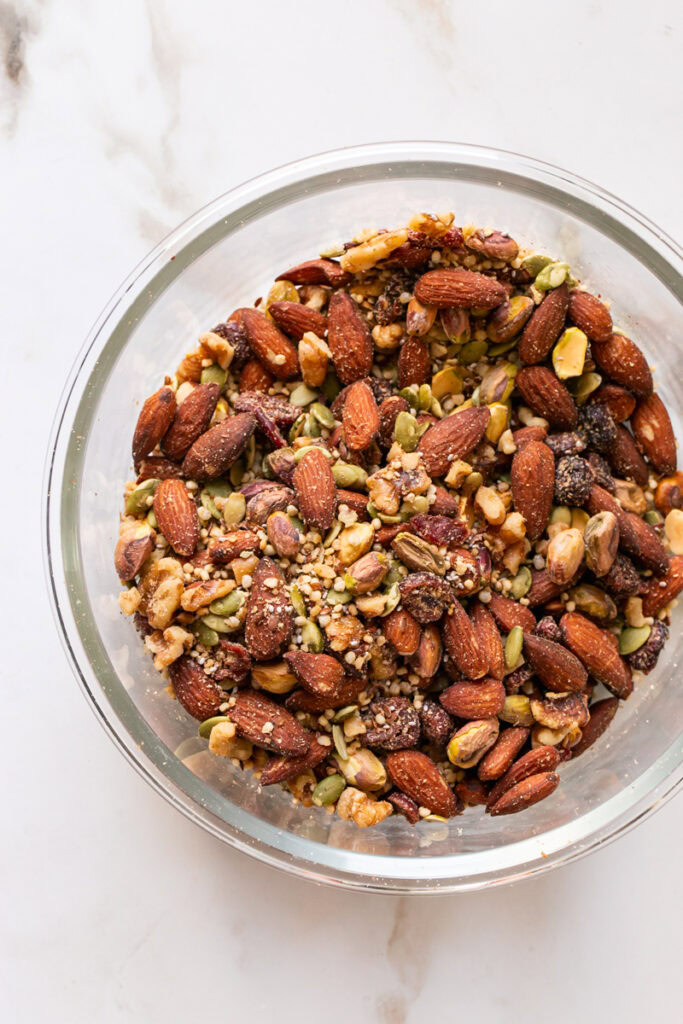 mixed nuts and seeds in a glass bowl.