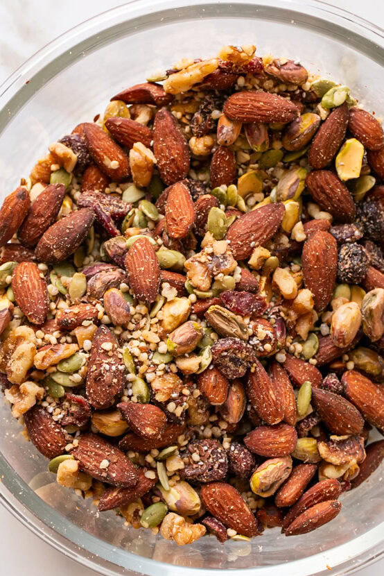 mixed nuts and seeds in a glass bowl.