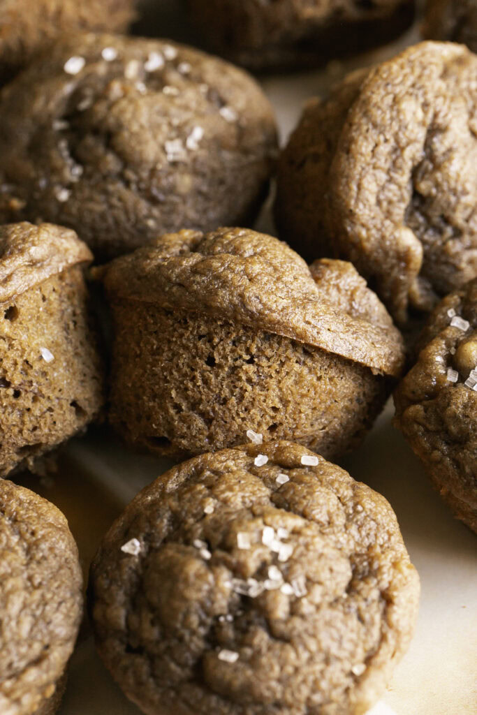 close up 3/4 shot of mini apple cider banana bread muffins.