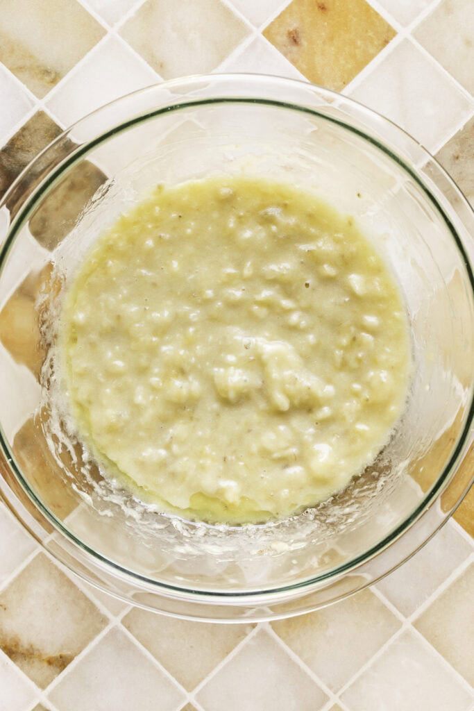 mashed bananas in a glass bowl.