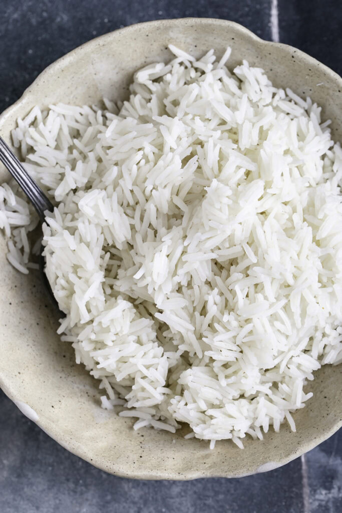 close up overhead shot of a bowl of cooked basmati rice.