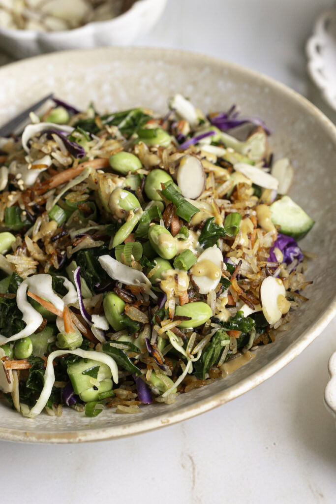 close up 3/4 shot of Kale Edamame Crispy Rice Salad.