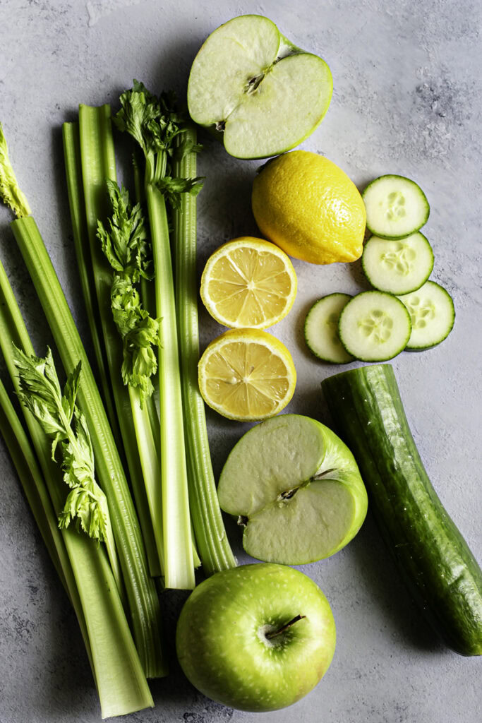 fresh whole celery, green apple, cucumber, and lemon.