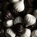 chocolate and white chocolate candy kisses piled on top of one another.