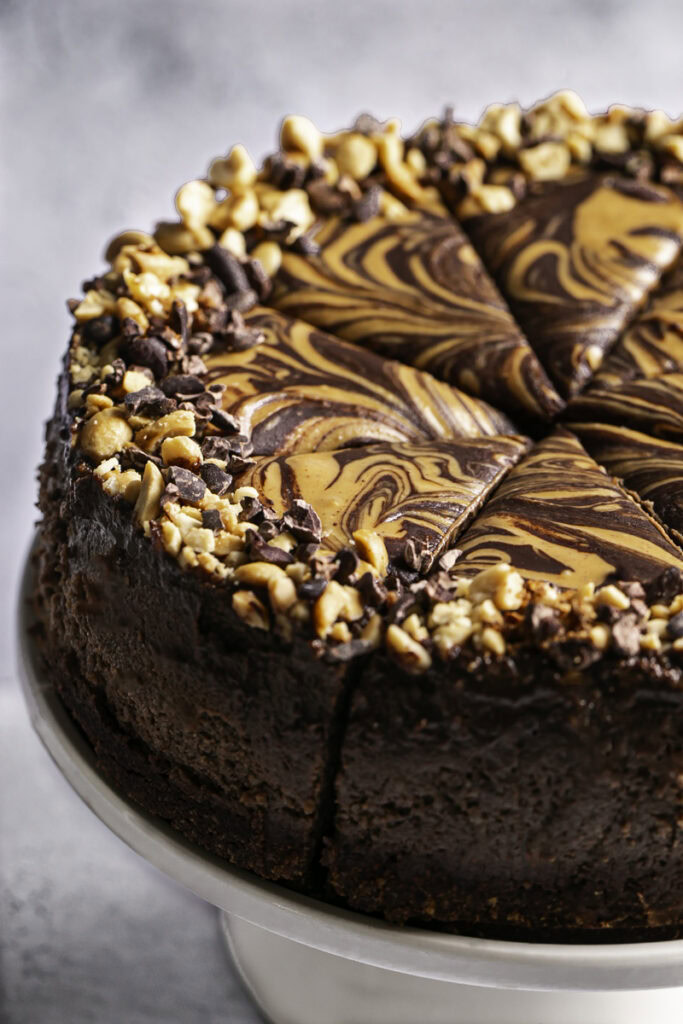 vegan triple chocolate peanut butter cheesecake sliced.